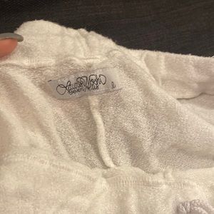 Capri white sweatpants with lips in blue and pink. Used for beach cover up